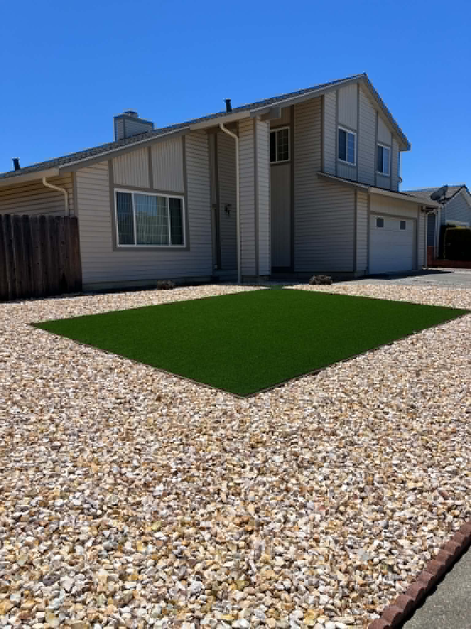 Artificial grass and decorative gravel installation